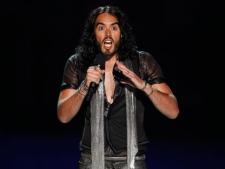 Russell Brand is seen on stage during a tribute for Amy Winehouse at the MTV Video Music Awards on Sunday Aug. 28, 2011, in Los Angeles. (AP Photo/Matt Sayles)