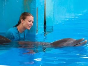 Austin Highsmith is seen here in the role of Phoebe in Alcon Entertainment�s family adventure, �Dolphin Tale", in the Warner Bros. Pictures release. �Dolphin Tale" dethroned "The Lion King" in the weekend box office. The "Dolphin Tale" held up well with $14.2 million in it's second weekend to take the #1 spot from the "Lion King", the Disney reissue that had been at the top of the past two weekends. (AP Photo/Jon Farmer, Alcon Entertainment)