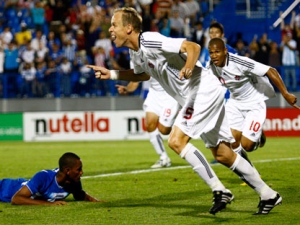Canada's Kevin McKenna celebrates his goal against Honduras with teammate Simeon Jackson, rear, during first half of a men's international friendly soccer game Tuesday, September 7, 2010 in Montreal. THE CANADIAN PRESS/Paul Chiasson
