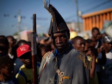 A man dressed as a colonial soldier parades during a ceremony to commemorate the 205th anniversary of the killing of Jean-Jacques Dessalines, a leader of the Haitian Revolution against France in Port-au-Prince, Haiti, Monday, Oct. 17, 2011.(AP Photo/Ramon Espinosa)