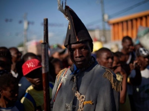 A man dressed as a colonial soldier parades during a ceremony to commemorate the 205th anniversary of the killing of Jean-Jacques Dessalines, a leader of the Haitian Revolution against France in Port-au-Prince, Haiti, Monday, Oct. 17, 2011.(AP Photo/Ramon Espinosa)