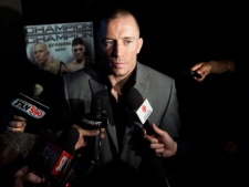 UFC welterweight champion Georges St-Pierre speaks to reporters during a press conference in Toronto Tuesday, September 6, 2011. (THE CANADIAN PRESS/Darren Calabrese)