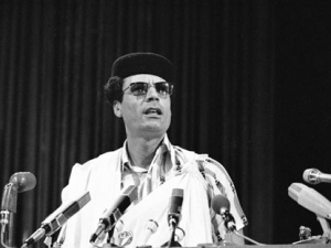 In this Aug. 18, 1976 photo, Moammar Gadhafi , the Libyan leader, speaks to the summit meeting of the nonaligned nations in Colombo, Sri Lanka. He said he supports terrorism that is equated with �the struggle of a people for independence,� but not kidnapping and robbery. His death on Thursday at age 69 � confirmed by Prime Minister Mahmoud Jibril � came as Libyan fighters defeated Gadhafi's last holdouts in his hometown of Sirte, the last major site of resistance in the country. (AP Photo)