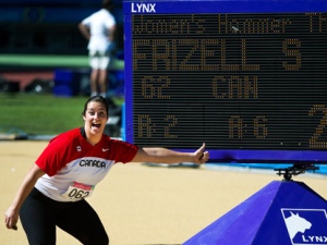 Canada's Sultana Frizell hams it up for the camera after winning silver in women's hammer throw at the 2011 Pan American Games in Guadalajara, Mexico on Monday, Oct. 24, 2011. (THE CANADIAN PRESS/Nathan Denette)