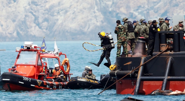 Divers search for bodies in sunken ferry