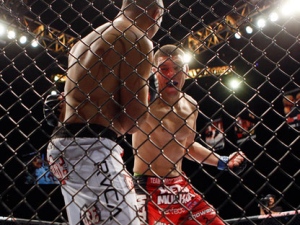 Nick Diaz, right, throws a punch at BJ Penn during a mixed martial arts welterweight bout, Saturday, Oct. 29, 2011, in Las Vegas. Diaz won by unanimous decision. (AP Photo/Isaac Brekken)