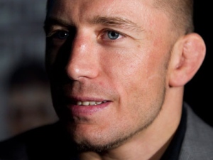 UFC welterweight champion Georges St-Pierre speaks to reporters during a press conference in Toronto Tuesday, September 6, 2011. (THE CANADIAN PRESS/Darren Calabrese)