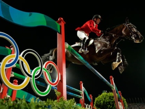 A Thursday, Aug. 21, 2008 photo from files showing Eric Lamaze of Canada as he rides Hickstead during the Equestrian Individual Jumping competition at the Beijing 2008 Olympics in Hong Kong. Olympic show jumping champion Eric Lamaze's horse Hickstead died during a World Cup event Sunday, after collapsing to the ground and writhing in pain inside a packed arena in Verona Italy. The Canadian partnership had just completed the 13-fence course with a single rail down in the middle of the combination when the horse fell ill, the International Equestrian Federation said. (AP Photo/Susan Walsh, File)