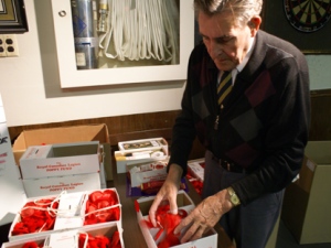 Joseph Cromwell organizes poppy boxes at Royal Canadian Legion East Toronto Branch 11 on Dawes Road on Monday, Nov. 7, 2011. (CP24/Chris Kitching)