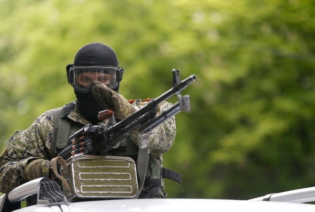 Pro-Russian gunman patrols Slovyansk