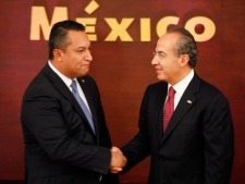 In this Wednesday July 14, 2010 file photo, Mexico's Interior Minister Francisco Blake Mora, left, shakes hands with Mexico's President Felipe Calderon at Mora's swearing in ceremony at Los Pinos presidential residence in Mexico City. The Mexican government said Friday Nov. 11, 2011, that Mora, Mexico's No. 2 government official next to the president, has died in a helicopter crash with seven others, including the pilot. (AP Photo/Eduardo Verdugo, File)