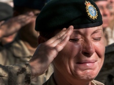 A Canadian soldier sheds a tear during the last Remembrance Day ceremony at Kandahar Air Field Friday, Nov. 11, 2011 in Kandahar, Afghanistan. (THE CANADIAN PRESS/Ryan Remiorz)