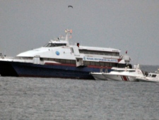 The hijacked passenger boat Kartepe is surrounded by coastal guards shortly before a commando raid in the Sea of Marmara, west of Istanbul, Turkey, early Saturday, Nov. 12, 2011. Turkish security forces ended a 12-hour hostage drama by killing a Kurdish rebel hijacker, who commandeered the ferry with 18 passengers, in the pre-dawn lightning raid on Saturday, authorities said. No one else was hurt. (AP Photo)