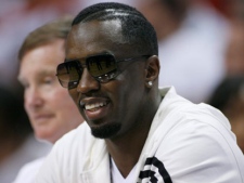 Sean "P. Diddy" Combs watches Game 1 of a second-round NBA playoff basketball series between the Miami Heat and the Boston Celtics, Sunday, May 1, 2011 in Miami. (AP Photo/Jeffrey M. Boan)