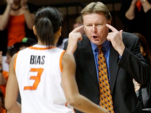 Oklahoma State head coach Kurt Budke, right, talks with guard Tiffany Bias, left, in the first half of an NCAA college basketball game against Oklahoma in Stillwater, Okla., Saturday, Jan. 29, 2011. (AP Photo/Sue Ogrocki)