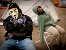 Occupy Los Angeles supporters rest after a long night at the camp in front of Los Angeles City Hall, Monday, Nov. 28, 2011, in Los Angeles. (AP Photo/Bret Hartman)