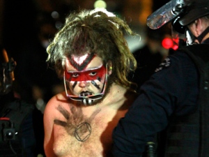 Los Angeles police officers arrest an Occupy Los Angeles protester at the encampment at the Losd Angeles city hall on Wednesday, Nov. 30, 2011. Police in Los Angeles and Philadelphia stormed Occupy Wall Street encampments in both cities Wednesday, demanding protestors leave demonstration sites. (AP Photo/Mark Boster/Pool)