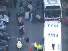 Seniors are loaded onto a TTC bus because of a carbon monoxide leak at their residence on O'Connor Drive in Toronto on Tuesday, Dec. 20, 2011. (CTV)