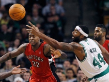 Boston Celtics forward Chris Wilcox (44) reaches for the ball against Toronto Raptors forward Ed Davis (32) during the second half of an NBA preseason basketball game in Boston, Wednesday, Dec. 21, 2011. (AP Photo/Elise Amendola)