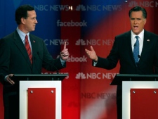 Former Pennsylvania Sen. Rick Santorum reacts as former Massachusetts Gov. Mitt Romney answers a question during a Republican presidential candidate debate at the Capitol Center for the Arts in Concord, N.H., Sunday, Jan. 8, 2012. (AP Photo/Charles Krupa)