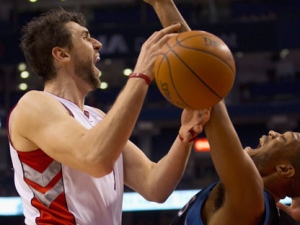 Toronto Raptors forward Andrea Bargnani collides with Minnesota Timberwolves forward Anthony Randolph (right) on his way to the hoop during first half NBA action in Toronto on Monday, Jan. 9, 2012. (THE CANADIAN PRESS/Frank Gunn)