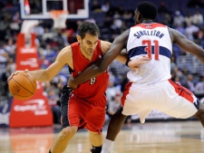 Toronto Raptors guard Jose Calderon (8), of Spain, tries to get past Washington Wizards forward Chris Singleton (31) during the first half of an NBA basketball game, Tuesday, Jan. 10, 2012, in Washington. (AP Photo/Nick Wass)