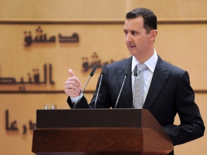 In this photo released by the Syrian official news agency SANA, Syrian President Bashar Assad delivers a speech at Damascus University, in Damascus, Syria, Tuesday, Jan. 10, 2012. Assad said Tuesday he will not step down, insisting that he still has his people's support despite a 10-month-old uprising against him. In his fourth speech since the Syrian revolt began in March, Assad also lashed out at the Arab League and accused the Cairo-based bloc of failing to protect Arab interests. The president has made few public appearances since the anti-government uprising began in March, inspired by the revolutions sweeping the Arab world. The regime's crackdown on dissent has killed thousands and led to international isolation and sanctions. (AP Photo/SANA)