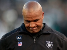 In this Jan. 1, 2012 file photo, Oakland Raiders head coach Hue Jackson looks down on the field during the fourth quarter of an NFL football game against the San Diego Chargers in Oakland, Calif. A person with knowledge of the situation says the Raiders have fired coach Jackson after one season and a disappointing 8-8 record. ESPN first reported Jackson's firing. The person spoke to The Associated Press on the condition of anonymity Tuesday, Jan. 10, 2012, because the move had not yet been announced ahead of the Raiders' scheduled 2 p.m. PST news conference to introduce new general manager Reggie McKenzie. (AP Photo/Marcio Jose Sanchez)