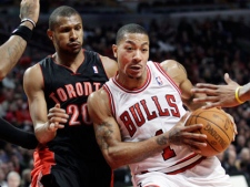 Chicago Bulls guard Derrick Rose (1) drives to the basket as Toronto Raptors guard Leandro Barbosa (20) guards during the third quarter of an NBA basketball game in Chicago on Saturday, Jan. 14, 2012. The Bulls won 77-64. (AP Photo/Nam Y. Huh)