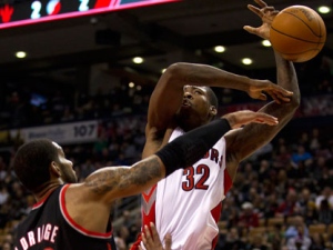 Portland Trail Blazers forward LaMarcus Aldridge (left) knocks the ball away from Toronto Raptors forward Ed Davis (32) during first half NBA action in Toronto on Friday, Jan. 20, 2012. (THE CANADIAN PRESS/Frank Gunn)