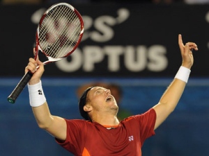 Australia's Lleyton Hewitt celebrates his win over Canada's Milos Raonic in their third round match at the Australian Open tennis championship, in Melbourne, Australia, Saturday, Jan. 21, 2012.(AP Photo/Andrew Brownbill)