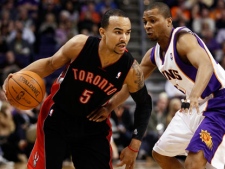 Toronto Raptors' Jerryd Bayless (5) drives against Phoenix Suns' Sebastian Telfair during the first half of an NBA basketball game, Tuesday, Jan. 24, 2012, in Phoenix. (AP Photo/Matt York)