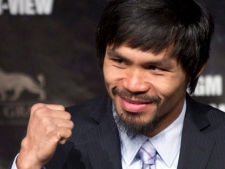 In this May 4, 2011, file photo, Manny Pacquiao pumps his fist during a news conference in Las Vegas. (AP Photo/Julie Jacobson, File)