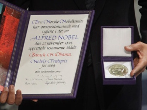 This is a Thursday, Dec. 10, 2009 file photo of U.S. President and Nobel Peace Prize laureate Barack Obama poses with his medal and diploma at the Nobel Peace Prize ceremony at City Hall in Oslo. The nomination deadline for the 2012 Nobel Peace Prize closed Wednesday Feb. 1, 2012 amid renewed criticism that the award committee has drifted away from the selection criteria established by prize founder Alfred Nobel. (AP Photo/Odd Andersen)