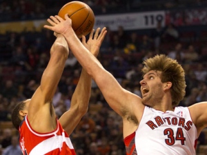 Washington Wizards centre JaVale McGee (left) is fouled by Toronto Raptors centre Aaron Gray (34) during first half NBA action in Toronto on Friday, Feb. 3, 2012. (THE CANADIAN PRESS/Frank Gunn)