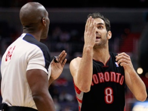 Toronto Raptors' Jose Calderon disputes a call with SirAllen Conner during the first half of an NBA basketball game against the Washington Wizards on Monday, Feb. 6, 2012, in Washington. (AP Photo/Haraz N. Ghanbari)