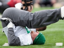 Saskatchewan Roughriders offensive lineman Marc Parenteau stretches at the start of practice for the 97th Grey Cup in Calgary on Wednesday, Nov. 25, 2009. (THE CANADIAN PRESS/Adrian Wyld)