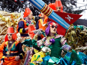 The Krewe of Mid-City's "Apocalypso: Party at the End of the World" parade rolls uptown on Sunday, Feb. 19, 2012, in New Orleans. (AP Photo/The Times-Picayune, Eliot Kamenitz)