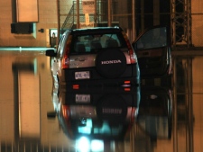 A driver became stranded after a watermain break flooded a parking lot on Steeles Avenue in Brampton early Tuesday, Feb. 21, 2012. (CP24/Tom Stefanac)