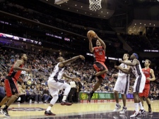 Toronto Raptors' DeMar DeRozan (10) goes up for a shot against the New Jersey Nets during the second half of an NBA basketball game on Sunday, Jan. 29, 2012, in Newark, N.J. The Raptors won 94-73. (AP Photo/Julio Cortez)