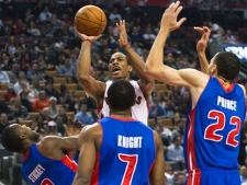 Toronto Raptors forward DeMar DeRozan, back centre, takes a shot past Detroit Pistons guard Rodney Stuckey, left, guard Brandon Knight, front centre, and forward Tayshaun Prince, right, during first half NBA basketball action in Toronto on Wednesday, Feb. 22, 2012. (THE CANADIAN PRESS/Nathan Denette)