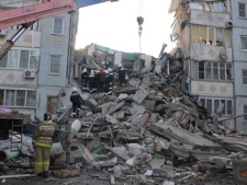 In this photo distributed by Astrakhan branch of the Ministry for Emergency Situations, rescuers inspect debris of an apartment building after an explosion Monday, Feb. 27, 2012, in Astrakhan, Russia. (AP Photo/ Astrakhan Branch, Ministry of Emergency Situations Press Service)