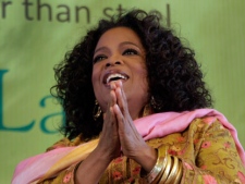 U.S. talk show host Oprah Winfrey reacts during an interview in a session at the Jaipur Literature Festival in Jaipur, in the western Indian state of Rajasthan, India, Sunday, Jan. 22, 2012. (AP Photo/Manish Swarup)