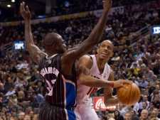 Toronto Raptors' DeMar DeRozan (right) drives at Orlando Magic's Jason Richardson during first half NBA basketball action in Toronto on Monday, March 5, 2012. (THE CANADIAN PRESS/Chris Young)