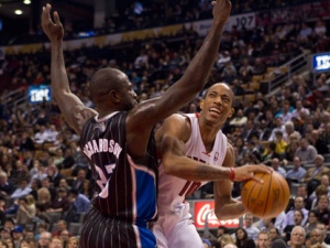 Toronto Raptors' DeMar DeRozan (right) drives at Orlando Magic's Jason Richardson during first half NBA basketball action in Toronto on Monday, March 5, 2012. (THE CANADIAN PRESS/Chris Young)