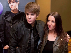 Justin Bieber, left, and his mother Pattie Lynn Mallette pose prior to the screening of his new film "Justin Bieber: Never Say Never" in Toronto on Tuesday, Feb. 1, 2011. (THE CANADIAN PRESS/Darren Calabrese)