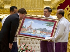 Canadian Foreign Affairs Minister John Baird receives a gift from Myanmar President Thein Sein at the presidential palace in Naypyitaw, Myanmar on Thursday, March 8, 2012. (THE CANADIAN PRESS/Paul Chiasson)