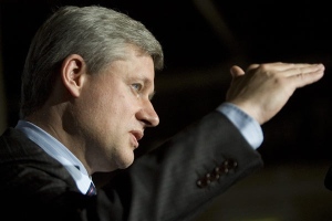 Conservative Leader Stephen Harper talks with reporters at a news conference in Fredericton, N.B., on Saturday, Sept. 13, 2008. (Tom Hanson / THE CANADIAN PRESS)