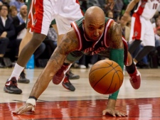 Milwaukee Bucks player Drew Gooden dives for a loose ball during an NBA game against the Toronto Raptors in Toronto on Sunday, March 11, 2012. (THE CANADIAN PRESS/Pawel Dwulit)