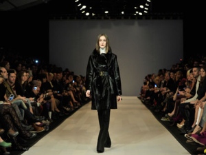 A model walks the runway for the Pink Tartan collection during the 2012 Toronto Fashion Week in Toronto on Thursday, March 15, 2012. (THE CANADIAN PRESS/Nathan Denette)